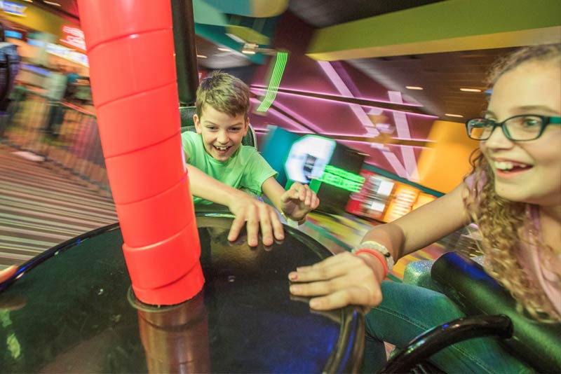 EduPLAYtion - Boy and Girl Smiling on Twister Ride